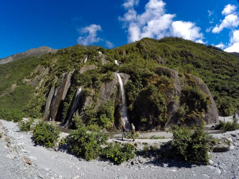 Walk past beautiful waterfalls on your way to Franz Josef Glacier