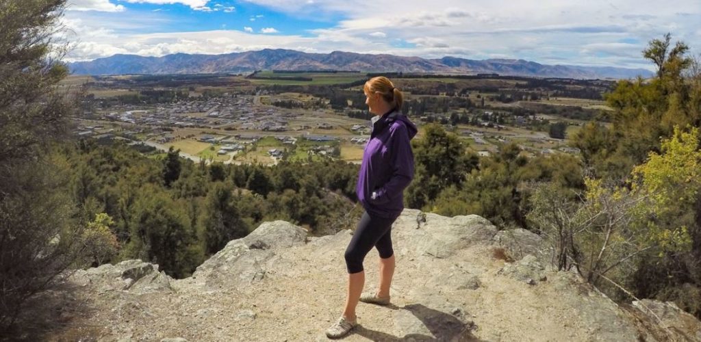 Sandra on top of Mt Iron in Wanaka, New Zealand