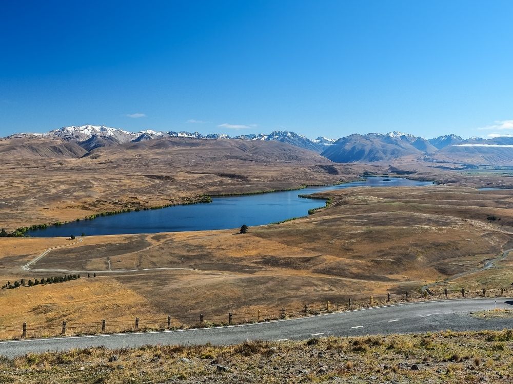 Free Lake Alexandrina and McGregor Walk in Tekapo - South Island - New Zealand - View looking over Lake Alexandrina to the mountains around Tekapo