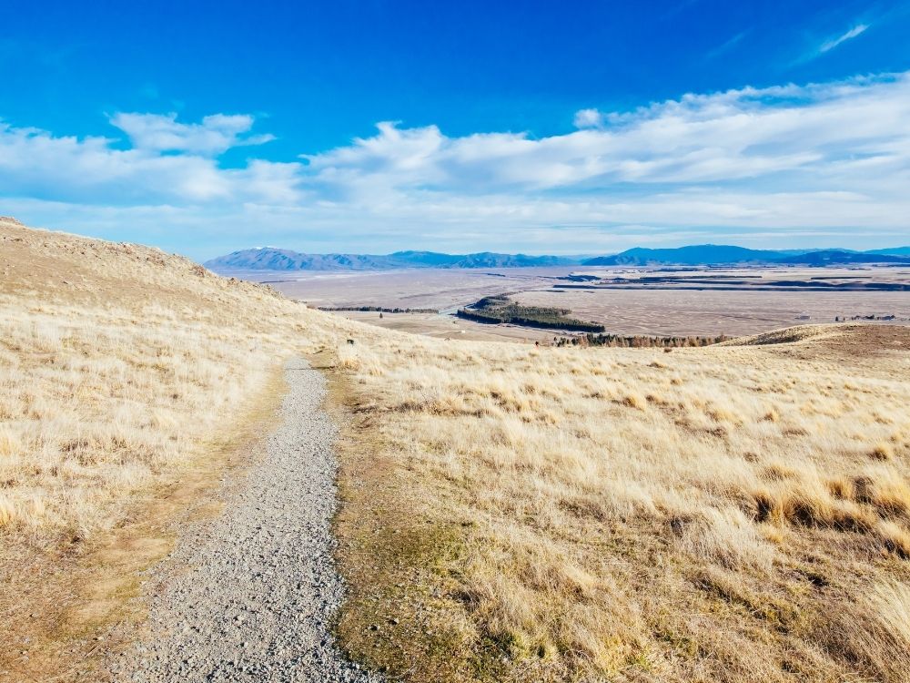Free Lake Tekapo Walkway in Tekapo - South Island - New Zealand - View looking over the walkway and mountains