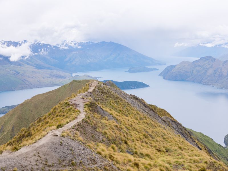 Looking across the track to the top of Roys Peak with the lakes in vies