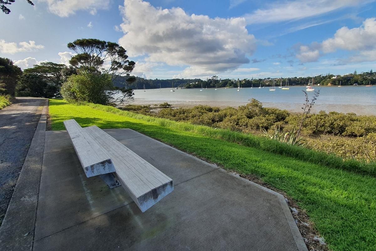Seat and great sea views on the Hobsonville Point Park Loop Walk in Auckland by Freewalks.nz