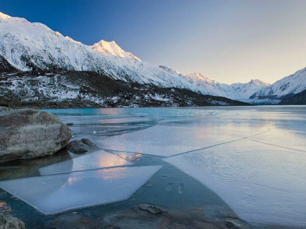 Sunrise at Tasman Lake in the Mt Cook region - Freewalks.nz