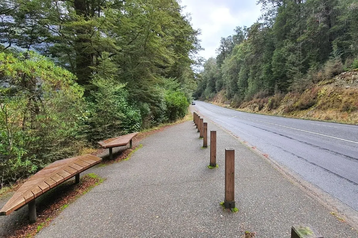 Roadside parking area and benches at Mirror Lakes walk entrance on Milford Road State Highway 94