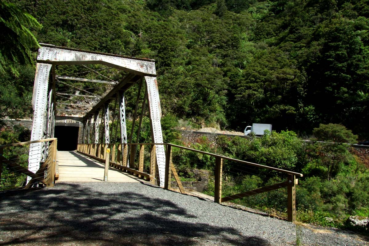 Walking across bridge to the start of the tunnel.|||||Karangahake Rail Tunnel Walk