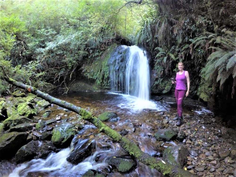 Tapanui Walking & Hiking Guide - Otago Region - New Zealand - Sandra at Whisky Gully Waterfall - Copyright Freewalks.nz