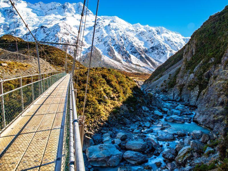 Walking over the second swing bridge on the Hooker Valley Track