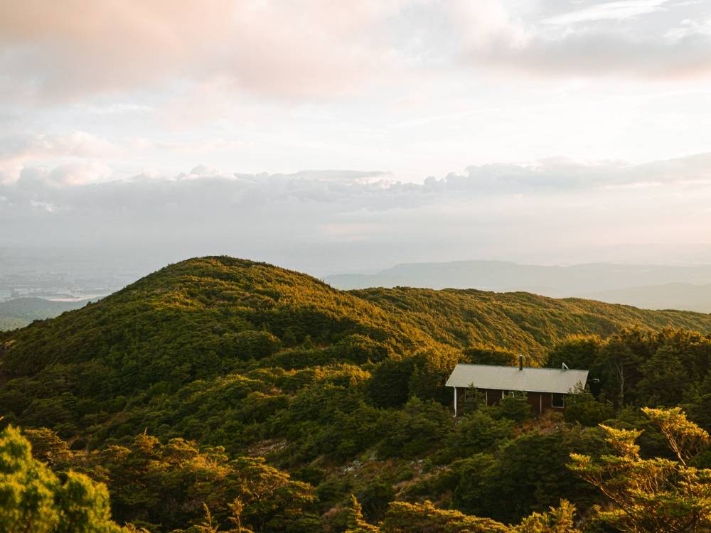 Blyth Hut with views over Tongariro National Park.