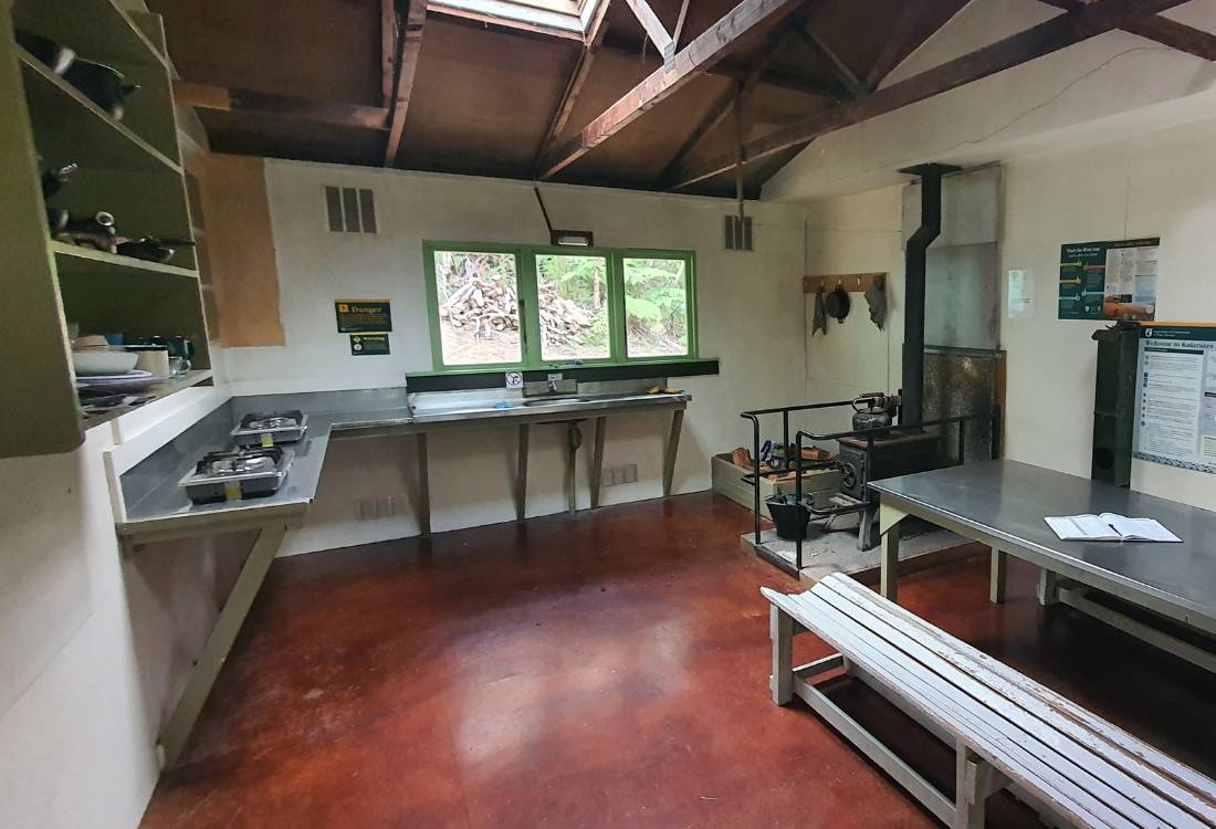 Kitchen and dining room in the Kaiaraara Hut on the Mt Hobson walk on Great Barrier Island by Sandra from Freewalks.nz New Zealand
