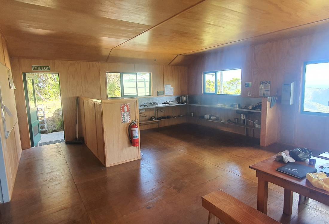 Kitchen and dining room in Mt Heale Hut on the Mt Hobson walk on Great Barrier Island by Sandra from Freewalks.nz New Zealand