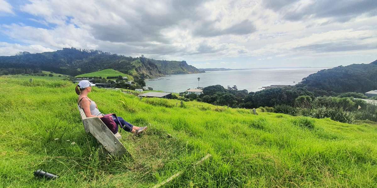 Me sitting on a seat enjoying the view from a walk I did out by Leigh.