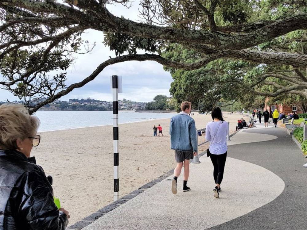 Couple walking along Mission Bay waterfront