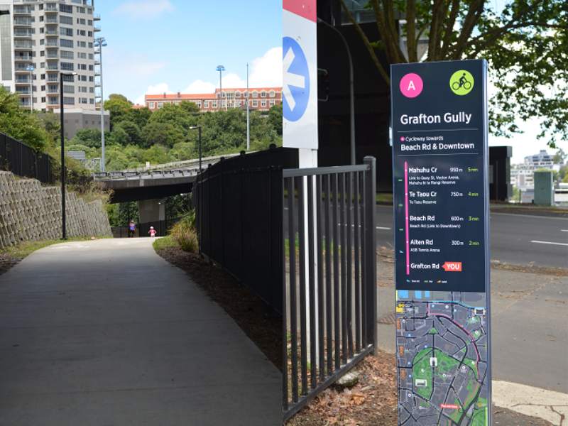 Grafton walkway and the Grafton Gully sign with a map in Auckland