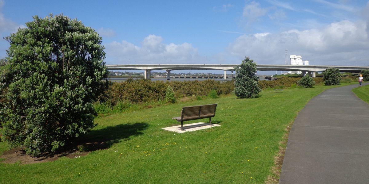 Seat next to the path looking out to Mangere Bridge