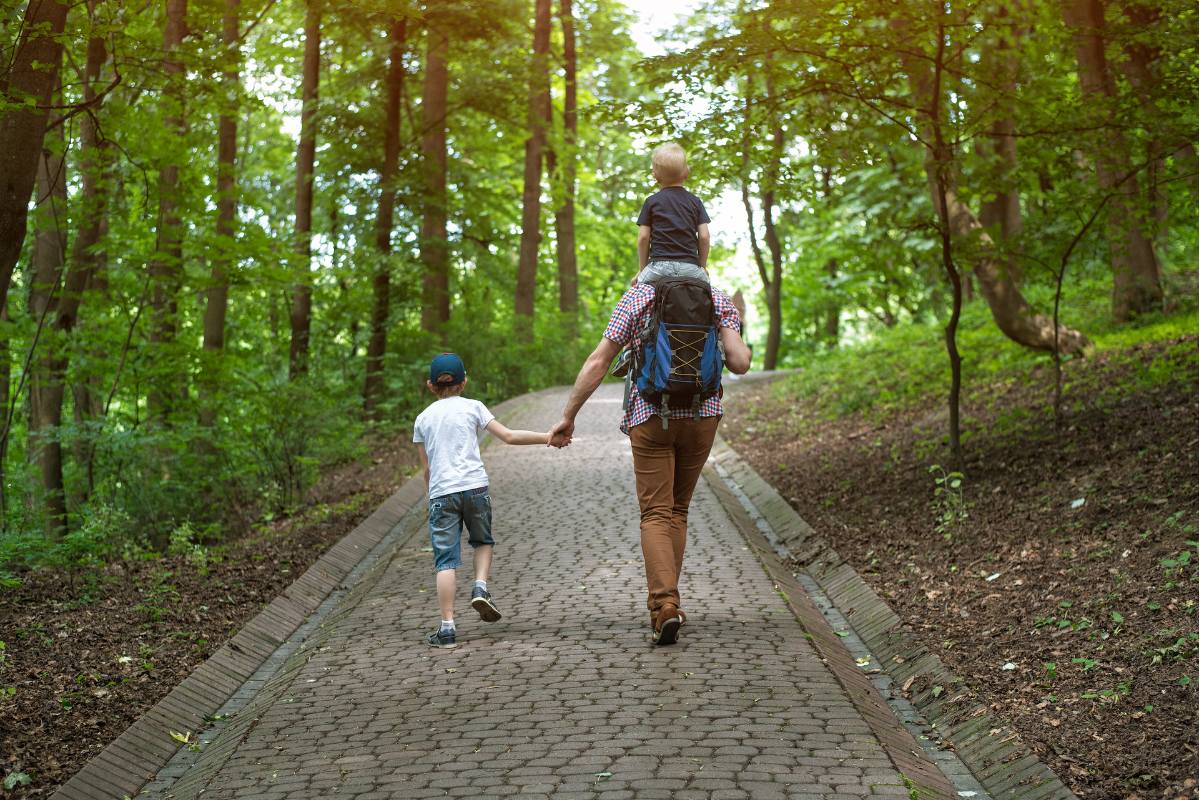 Children walking with dad in Auckland