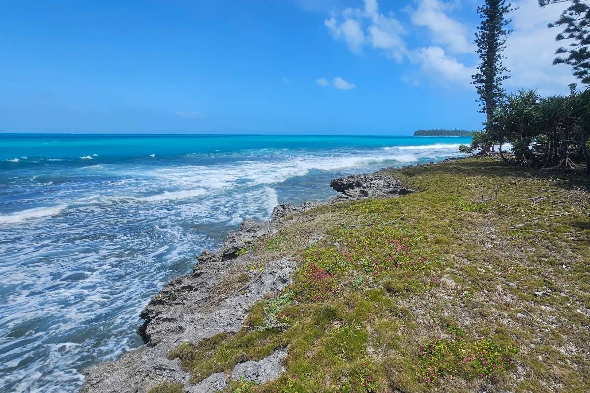 view to the beach waves and blue sky