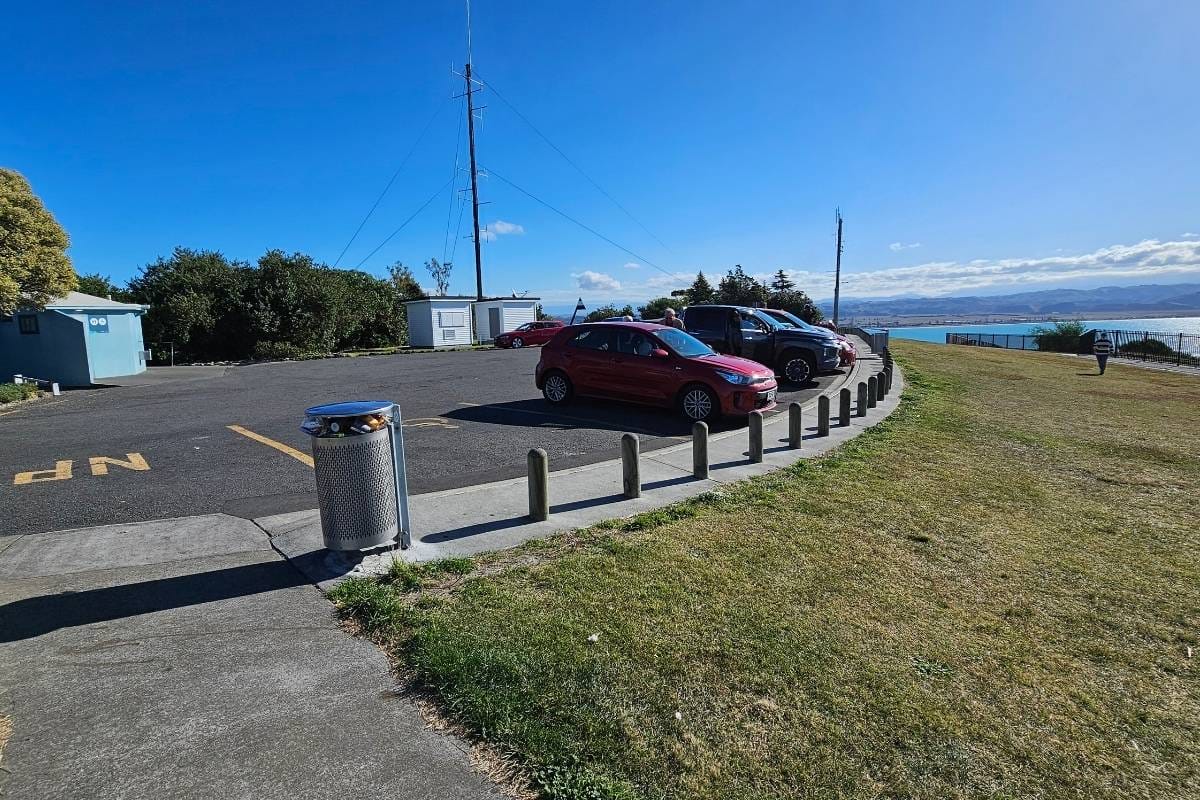 a parking lot with a view of the ocean