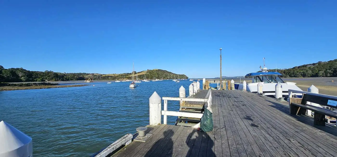 Sandspit wharf with the Kawau ferry at low tide