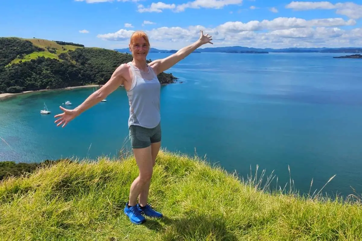 Walker celebrating the spectacular views at Marsden Cross Walk Rangihoua Bay