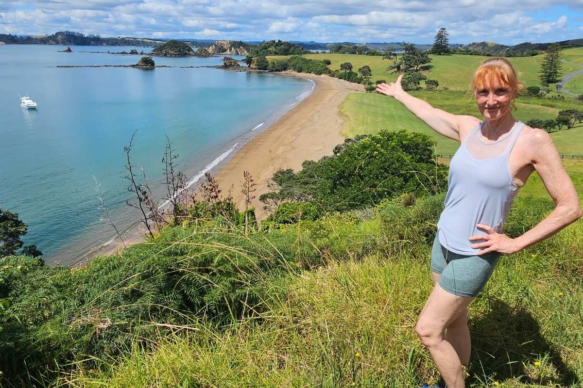 Sandra enjoying panoramic views at Marsden Cross Walk overlooking Rangihoua Bay