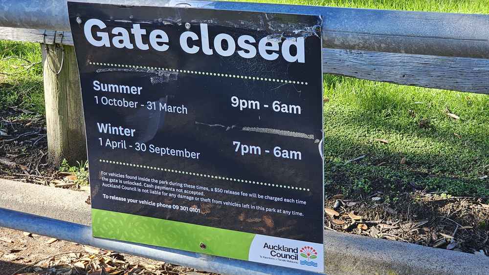 Gate closed hours sign at the Martins Bay car park